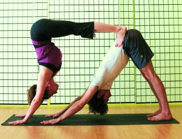 Young couple practicing acro yoga on mat in studio together. Acroyoga. Couple  yoga. Partner yoga. - Stock Image - Everypixel